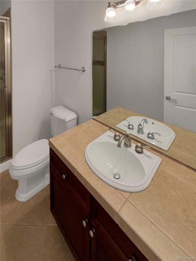 24955 E Roxbury Pl, Aurora, CO 80016 - bathroom featuring a shower stall, vanity, and tile patterned flooring