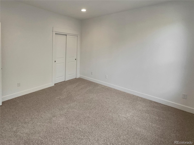 24955 E Roxbury Pl, Aurora, CO 80016 - unfurnished bedroom with carpet floors, recessed lighting, and a closet