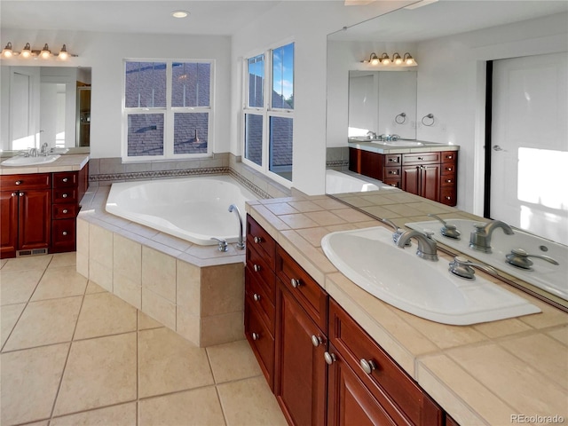 24955 E Roxbury Pl, Aurora, CO 80016 - full bathroom featuring two vanities, a bath, and tile patterned floors