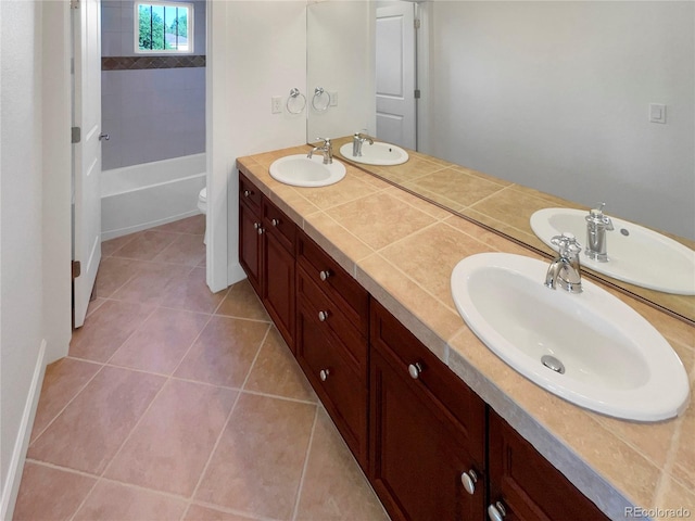 24955 E Roxbury Pl, Aurora, CO 80016 - full bathroom with double vanity, tile patterned flooring, and shower / tub combination