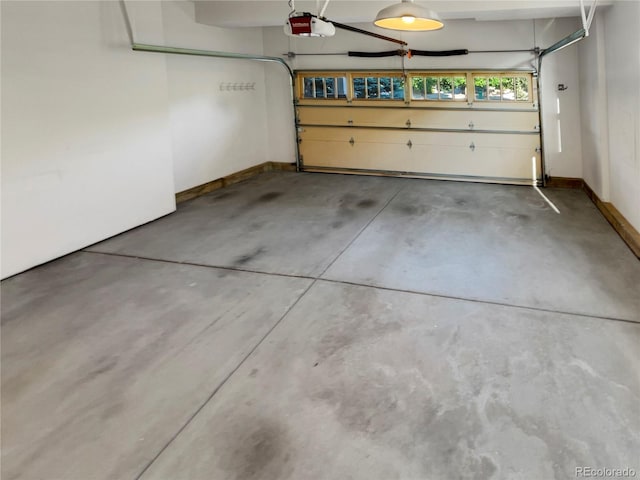 24955 E Roxbury Pl, Aurora, CO 80016 - garage featuring a garage door opener and baseboards