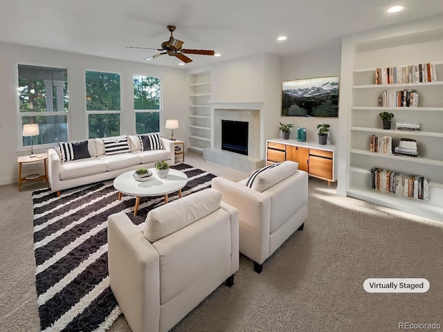 24955 E Roxbury Pl, Aurora, CO 80016 - living area featuring built in features, ceiling fan, light carpet, recessed lighting, and a fireplace with raised hearth