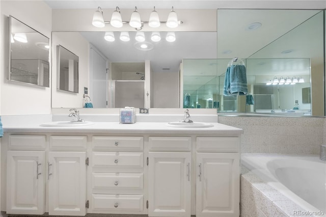 7160 W Stetson Pl Unit 27, Littleton, CO 80123 - bathroom with double vanity, a garden tub, and a shower stall
