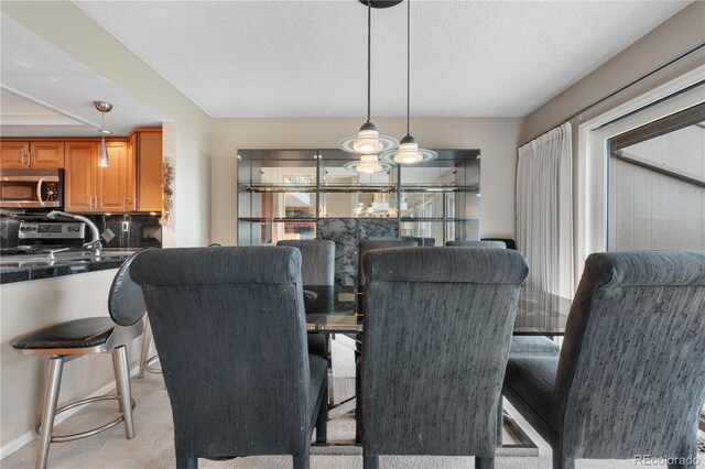 7160 W Stetson Pl Unit 27, Littleton, CO 80123 - dining space featuring light colored carpet and a textured ceiling