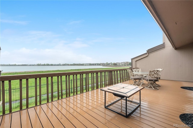 7160 W Stetson Pl Unit 27, Littleton, CO 80123 - wooden deck featuring a water view, outdoor dining area, and a yard