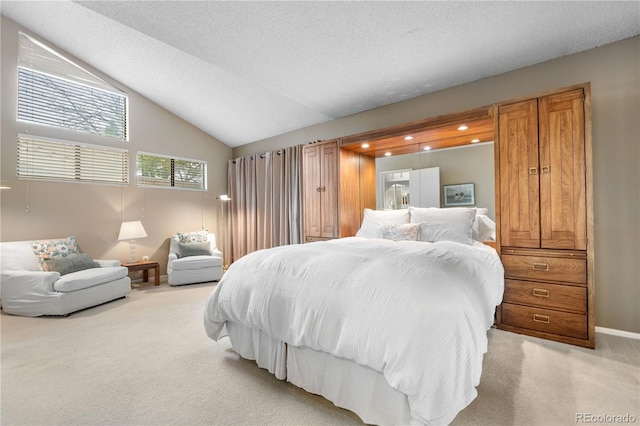 7160 W Stetson Pl Unit 27, Littleton, CO 80123 - bedroom featuring light colored carpet, vaulted ceiling, baseboards, and recessed lighting