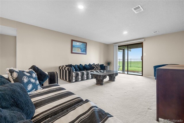 7160 W Stetson Pl Unit 27, Littleton, CO 80123 - living room featuring carpet floors, recessed lighting, and a textured ceiling
