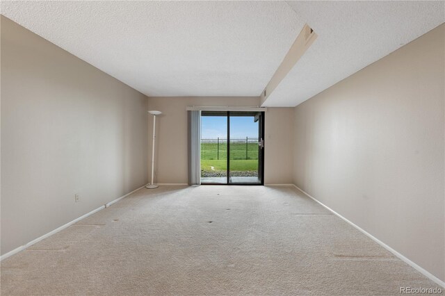 7160 W Stetson Pl Unit 27, Littleton, CO 80123 - unfurnished room featuring carpet floors, a textured ceiling, and baseboards