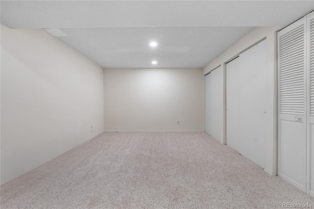 7160 W Stetson Pl Unit 27, Littleton, CO 80123 - unfurnished bedroom with carpet, two closets, and recessed lighting