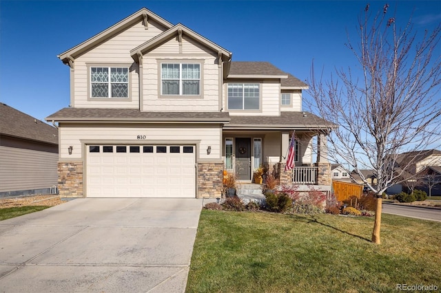 craftsman-style house featuring a porch, a garage, and a front lawn