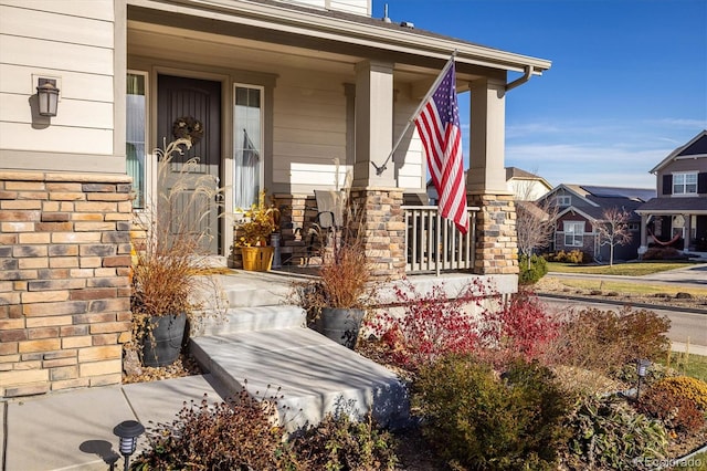 entrance to property featuring a porch