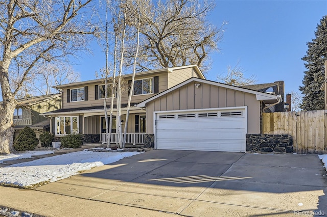 view of front of property with a garage and a porch