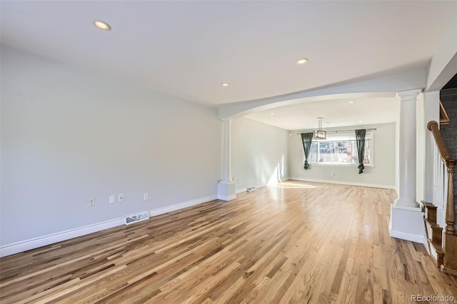 unfurnished living room with light hardwood / wood-style floors