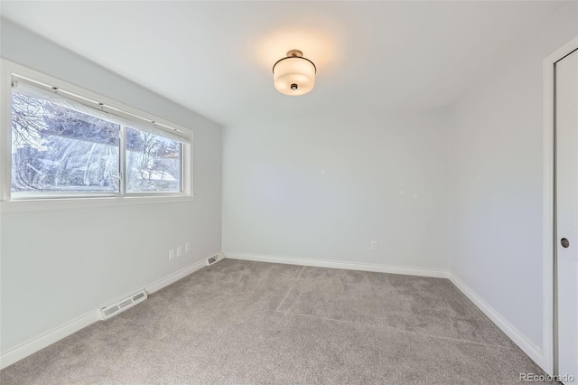 spare room with light colored carpet