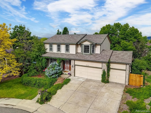 7513 Simms Ct, Arvada, CO 80005 - traditional-style home featuring concrete driveway, a shingled roof, and a garage