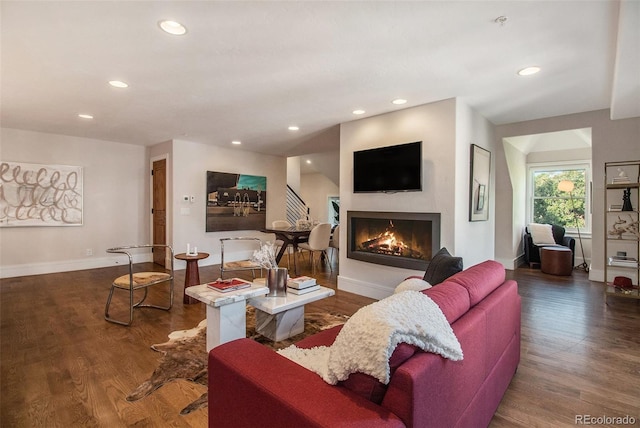 living room with dark hardwood / wood-style floors