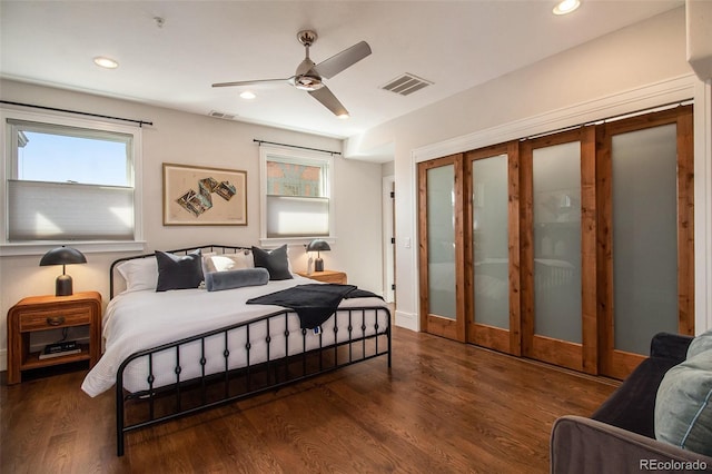 bedroom featuring ceiling fan and dark hardwood / wood-style floors