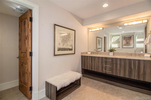 bathroom featuring tile patterned floors and vanity