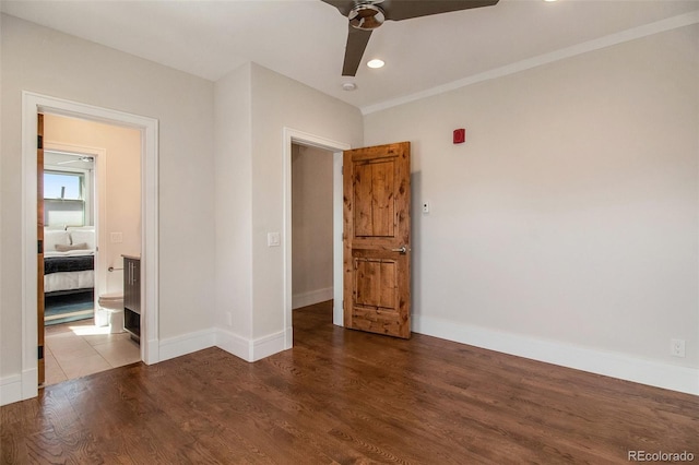 unfurnished bedroom featuring hardwood / wood-style floors and ceiling fan