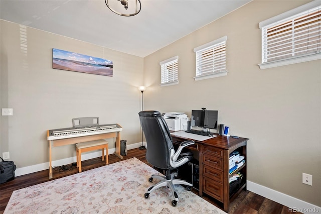 office featuring baseboards and wood finished floors