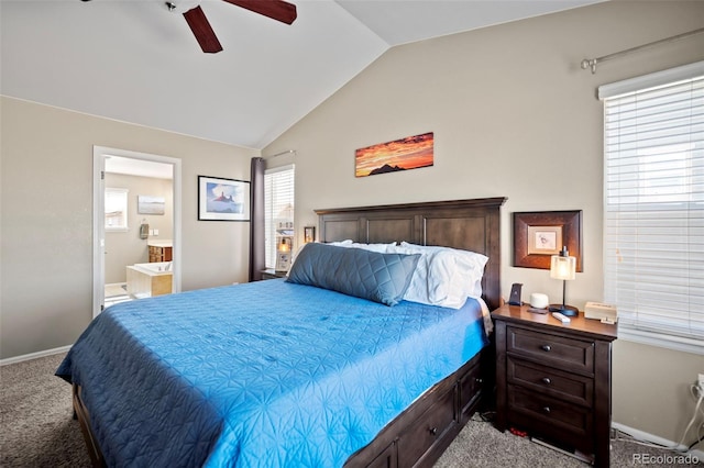 carpeted bedroom featuring vaulted ceiling, ceiling fan, baseboards, and ensuite bathroom