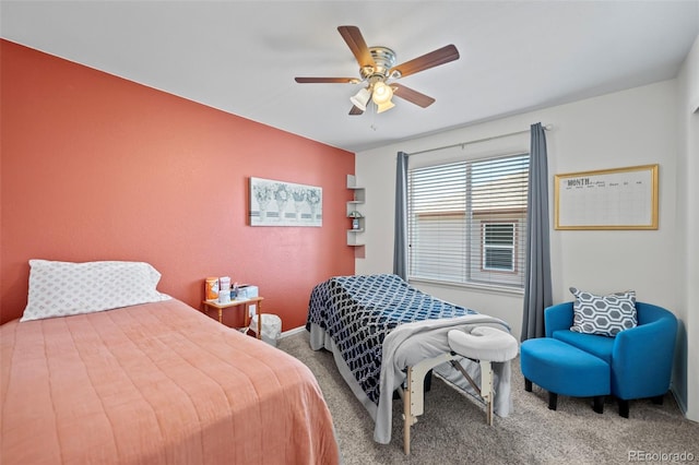 bedroom featuring ceiling fan, baseboards, and carpet flooring