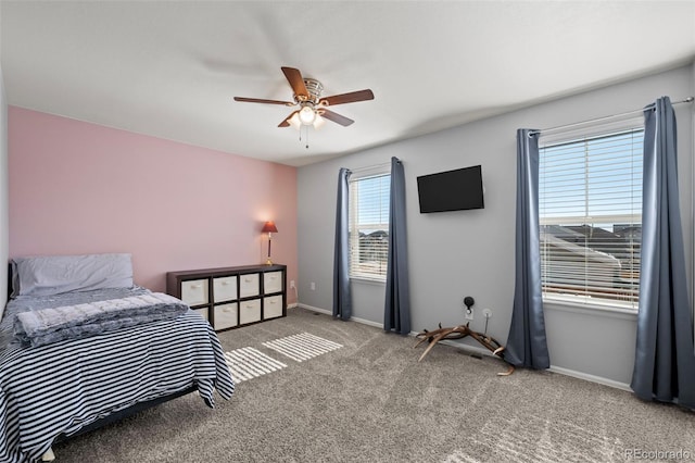 carpeted bedroom featuring ceiling fan and baseboards