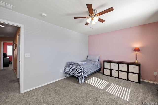 bedroom featuring a ceiling fan, carpet, visible vents, and baseboards