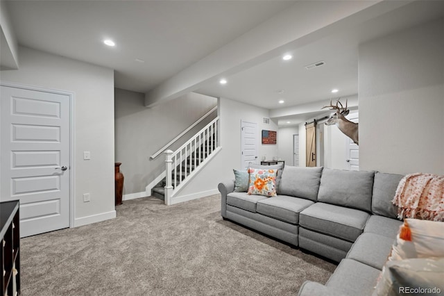 living room with a barn door, stairway, carpet flooring, and recessed lighting