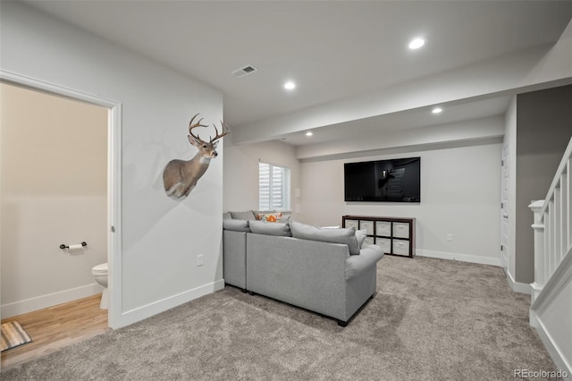 carpeted living room with stairway, recessed lighting, visible vents, and baseboards