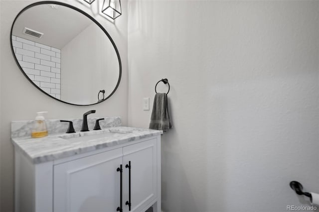 bathroom featuring visible vents and vanity