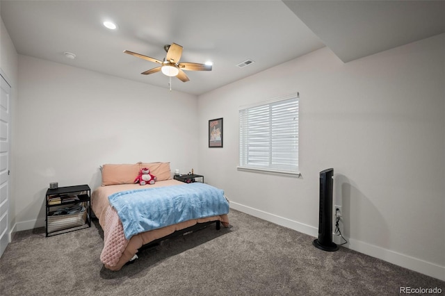 bedroom featuring a ceiling fan, visible vents, baseboards, and carpet flooring