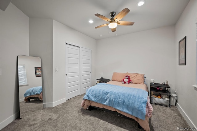 carpeted bedroom with baseboards, a closet, and recessed lighting