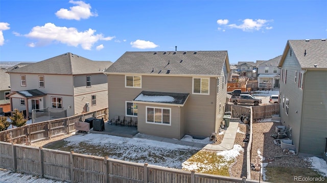 rear view of property with a patio area, a fenced backyard, and a residential view