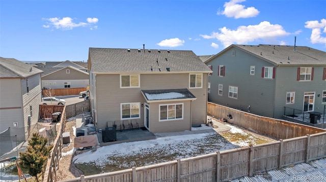 back of property with a patio area and a fenced backyard