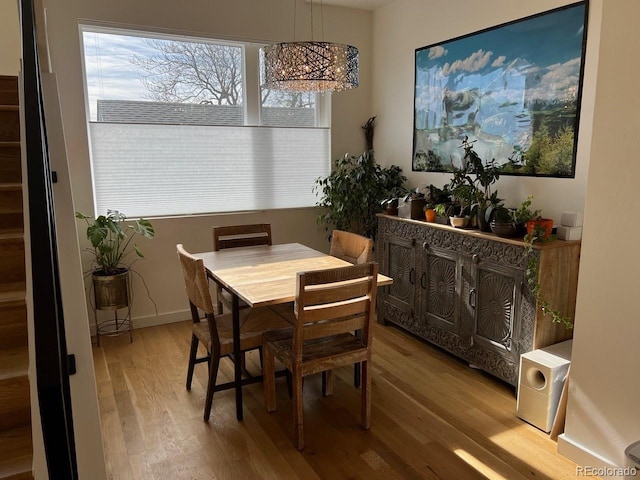 1284 Osceola St, Denver, CO 80204 - dining area featuring wood finished floors and a chandelier