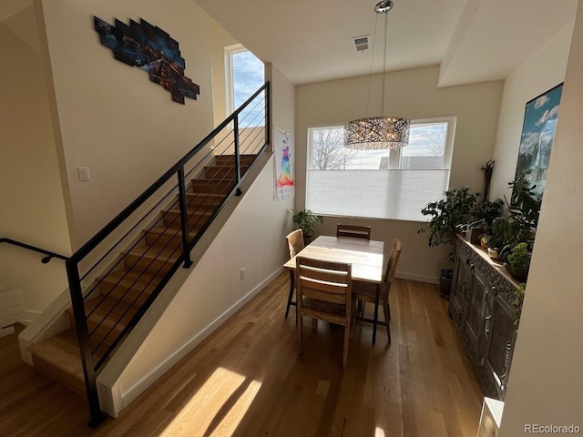 1284 Osceola St, Denver, CO 80204 - dining space with stairway and wood finished floors