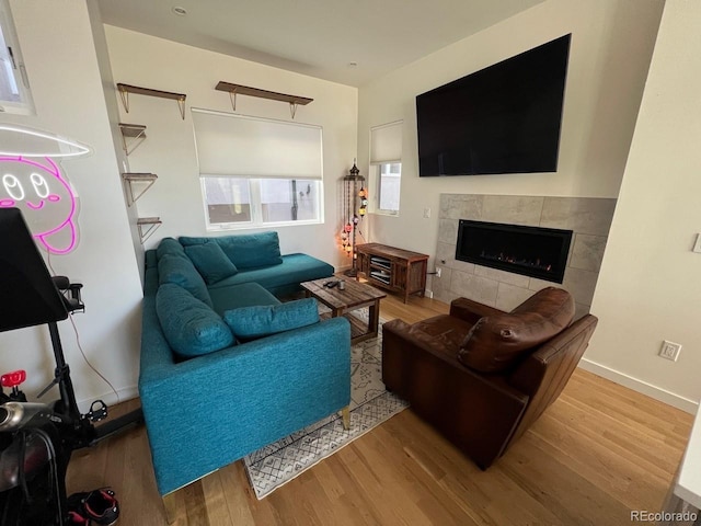 1284 Osceola St, Denver, CO 80204 - living area featuring wood finished floors and a tile fireplace