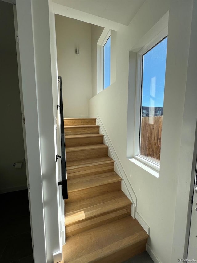 1284 Osceola St, Denver, CO 80204 - stairway with healthy amount of natural light and wood finished floors