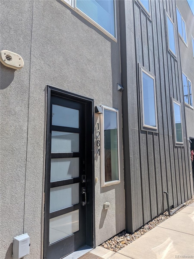 1284 Osceola St, Denver, CO 80204 - entrance to property featuring board and batten siding and stucco siding