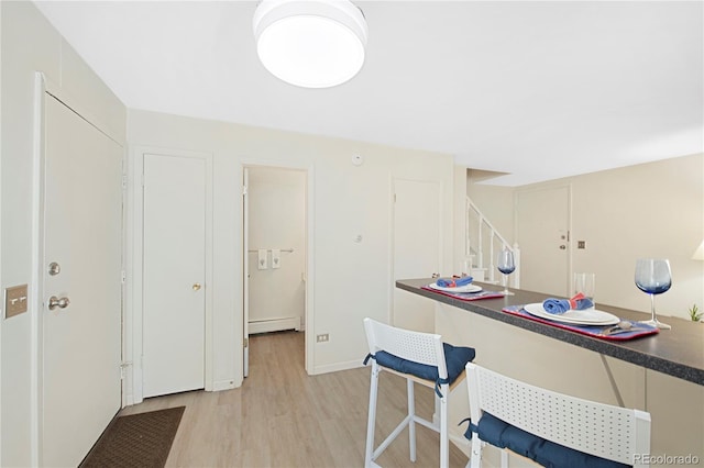 kitchen featuring light wood-type flooring and baseboard heating