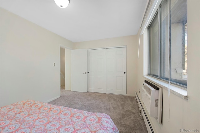 bedroom featuring light colored carpet, a closet, and an AC wall unit