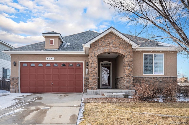 view of front of home featuring concrete driveway, stone siding, roof with shingles, an attached garage, and stucco siding