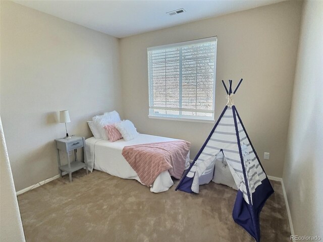 bedroom featuring carpet, visible vents, and baseboards