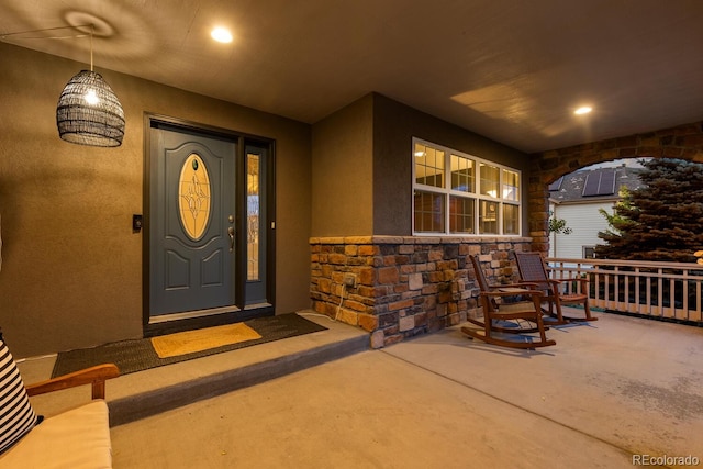 5322 Devils Head Cir, Golden, CO 80403 - entrance to property with covered porch, stone siding, and stucco siding