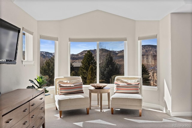 5322 Devils Head Cir, Golden, CO 80403 - sitting room featuring a mountain view, lofted ceiling, healthy amount of natural light, and carpet floors