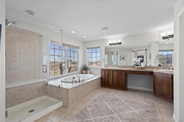 5322 Devils Head Cir, Golden, CO 80403 - bathroom featuring double vanity, tile patterned flooring, a garden tub, and a shower stall