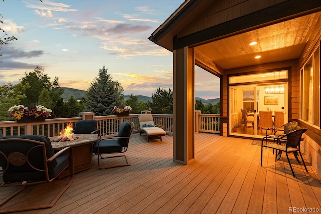 5322 Devils Head Cir, Golden, CO 80403 - deck at dusk with a fire pit and a mountain view