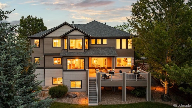 5322 Devils Head Cir, Golden, CO 80403 - back of house with a wooden deck, stairway, and roof with shingles