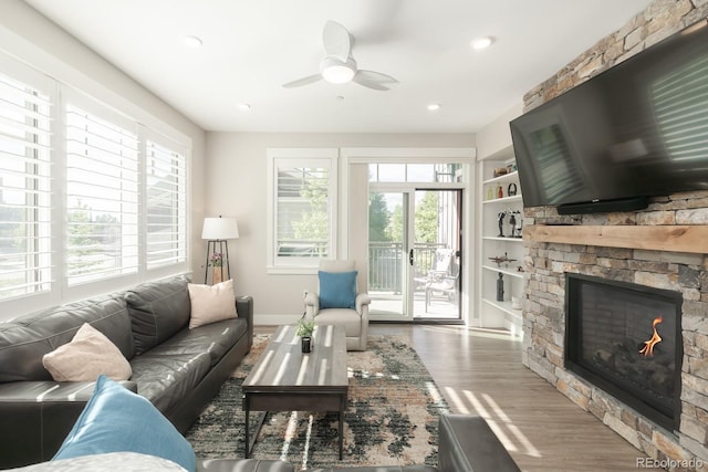 400 Baker Dr Unit Te103, Winter Park, CO 80482 - living room featuring a fireplace, wood finished floors, ceiling fan, built in shelves, and recessed lighting